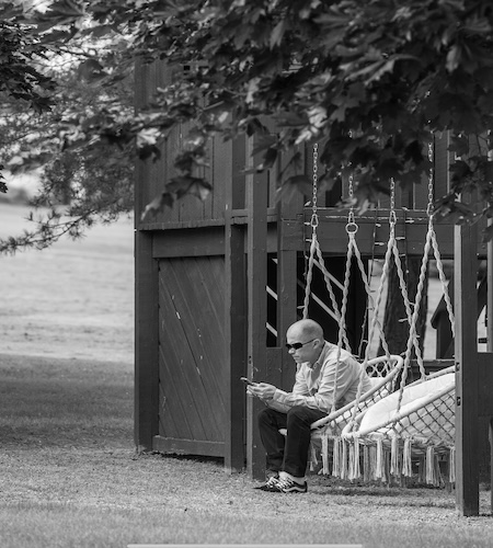Black and white photo of swings